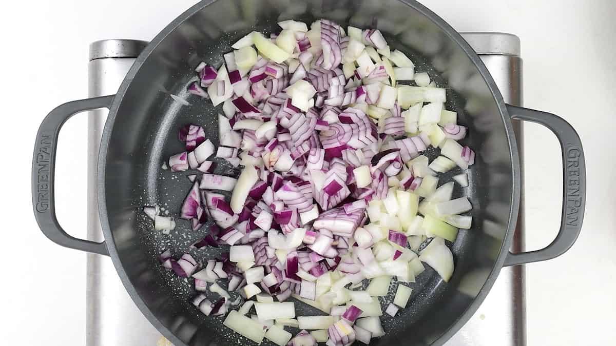 softening onions in a pan