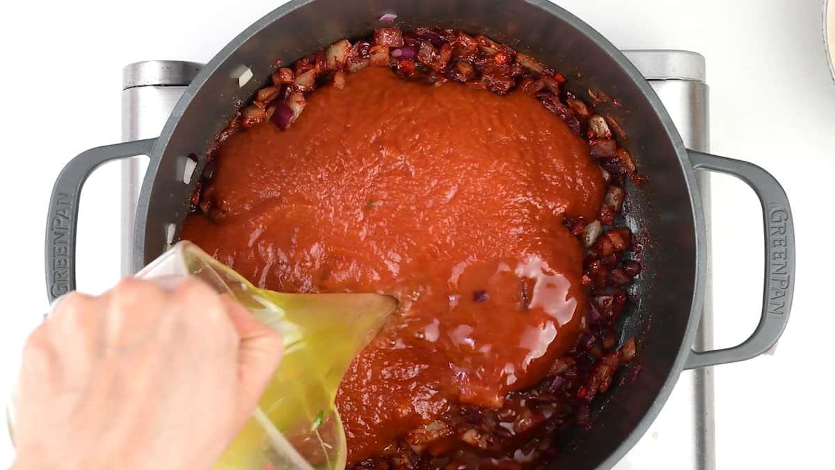 cooking masala sauce in a pot