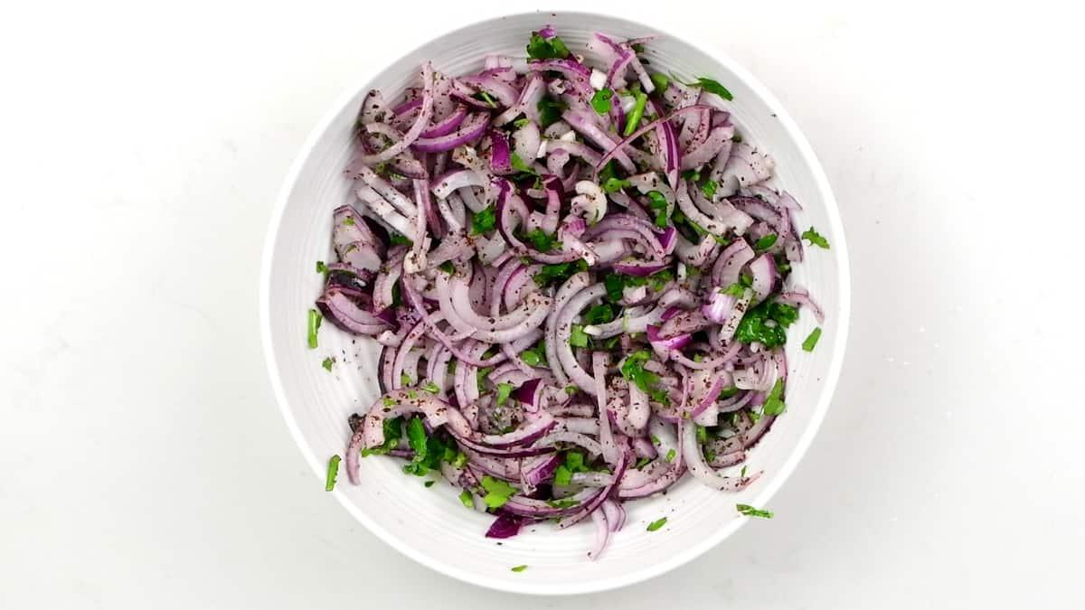 sumac onions in a white bowl