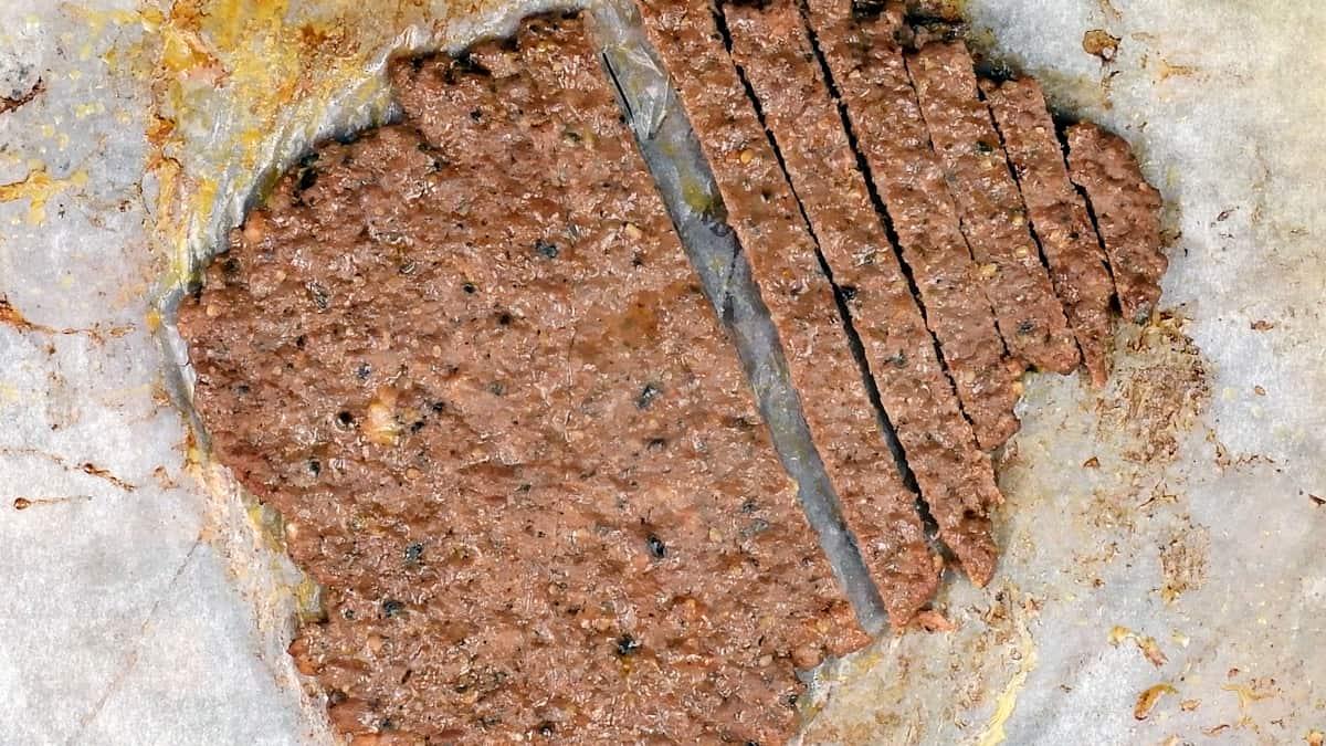 slicing doner meat into strips