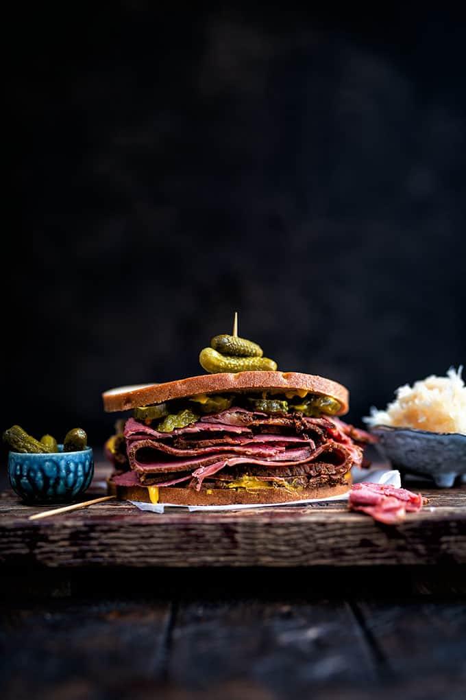 Pastrami sandwich with rye bread and pickles