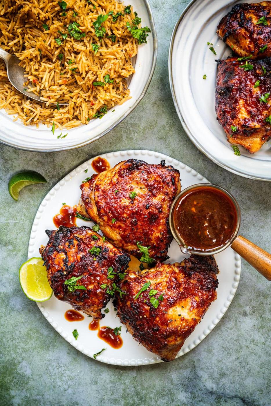 Perfectly charred chicken thighs in a glossy honey-garlic glaze, served with a fragrant coconut riceSticky, savory, and sweet—these Vietnamese-inspired honey garlic chicken thighs are marinated in a bold, flavorful sauce and cooked to juicy perfection in the air fryer or oven.