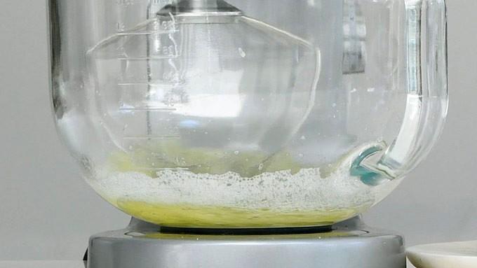 Whisking egg whites and cream of tartar in a stand mixer to make meringue