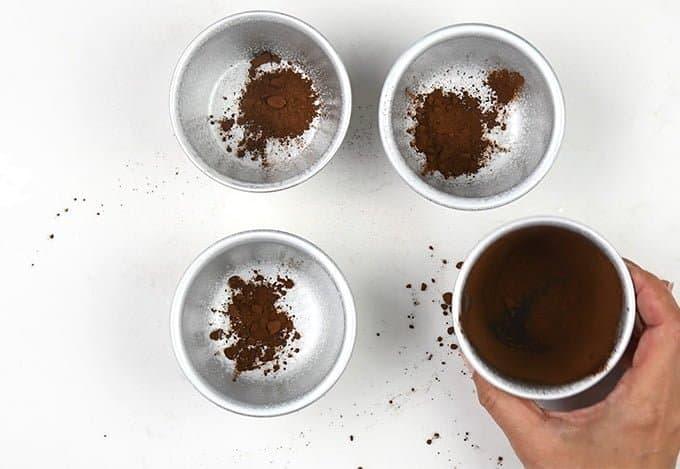 Dusting dariole moulds with cocoa powder