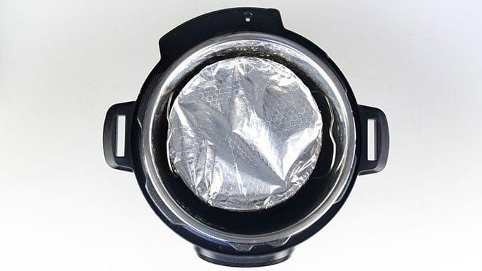 Cheesecake placed into a pressure cooker overhead view