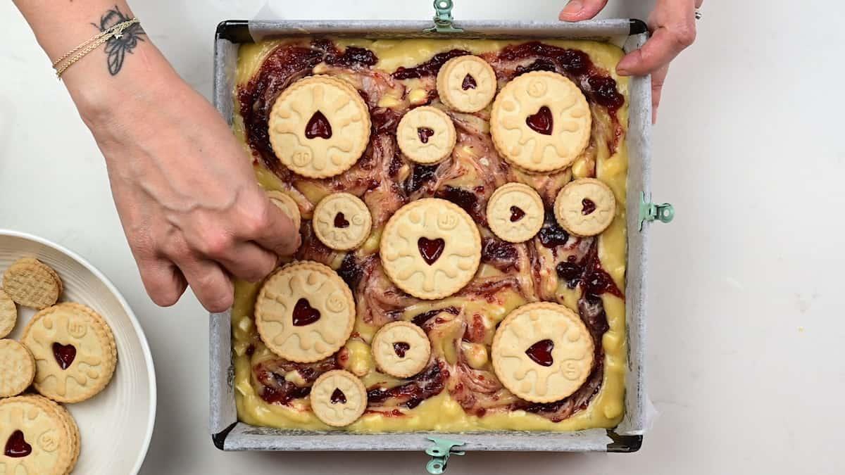 Topping blondies with Jammie Dodger biscuits
