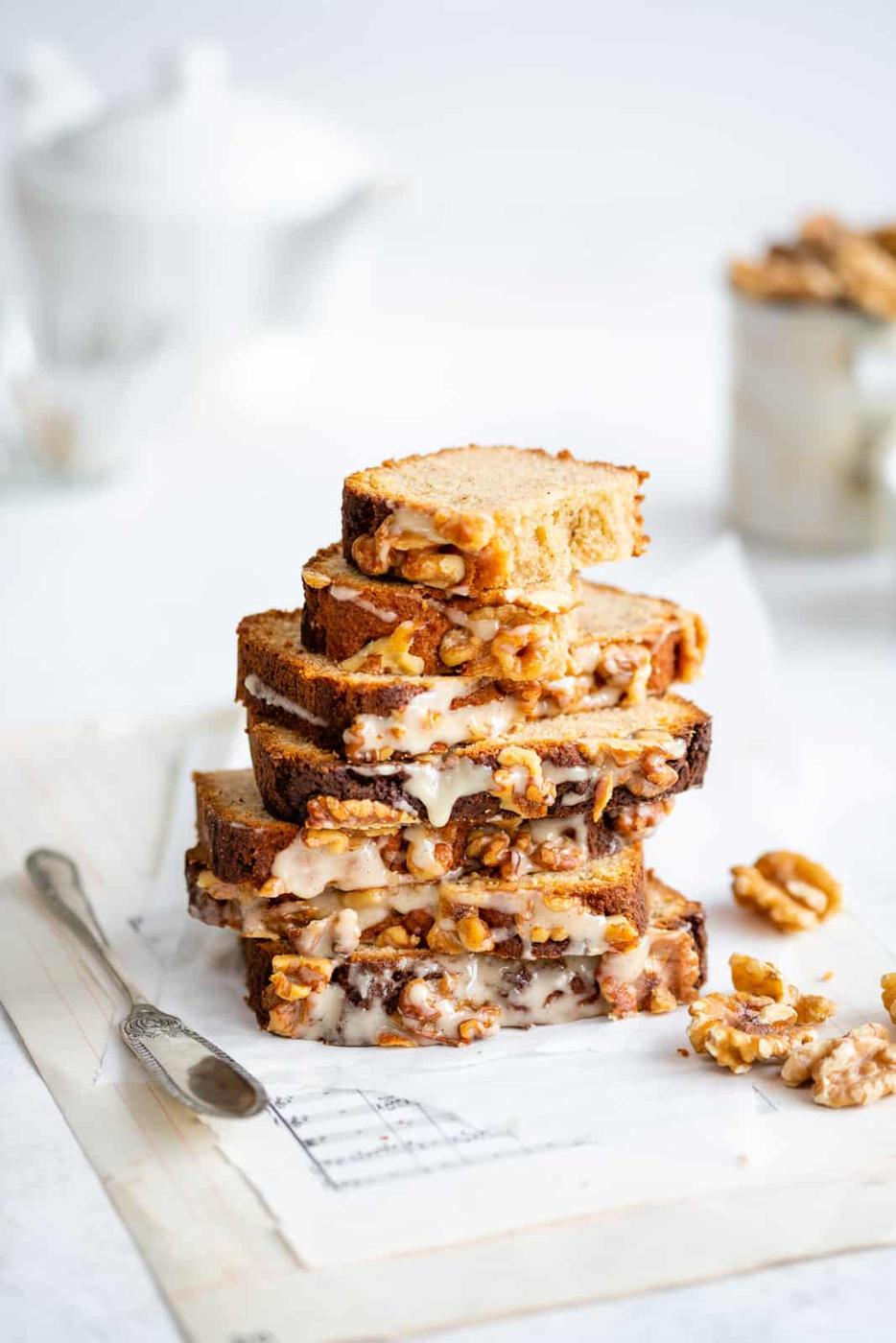 Slices of Keto banana bread stacked on a white background