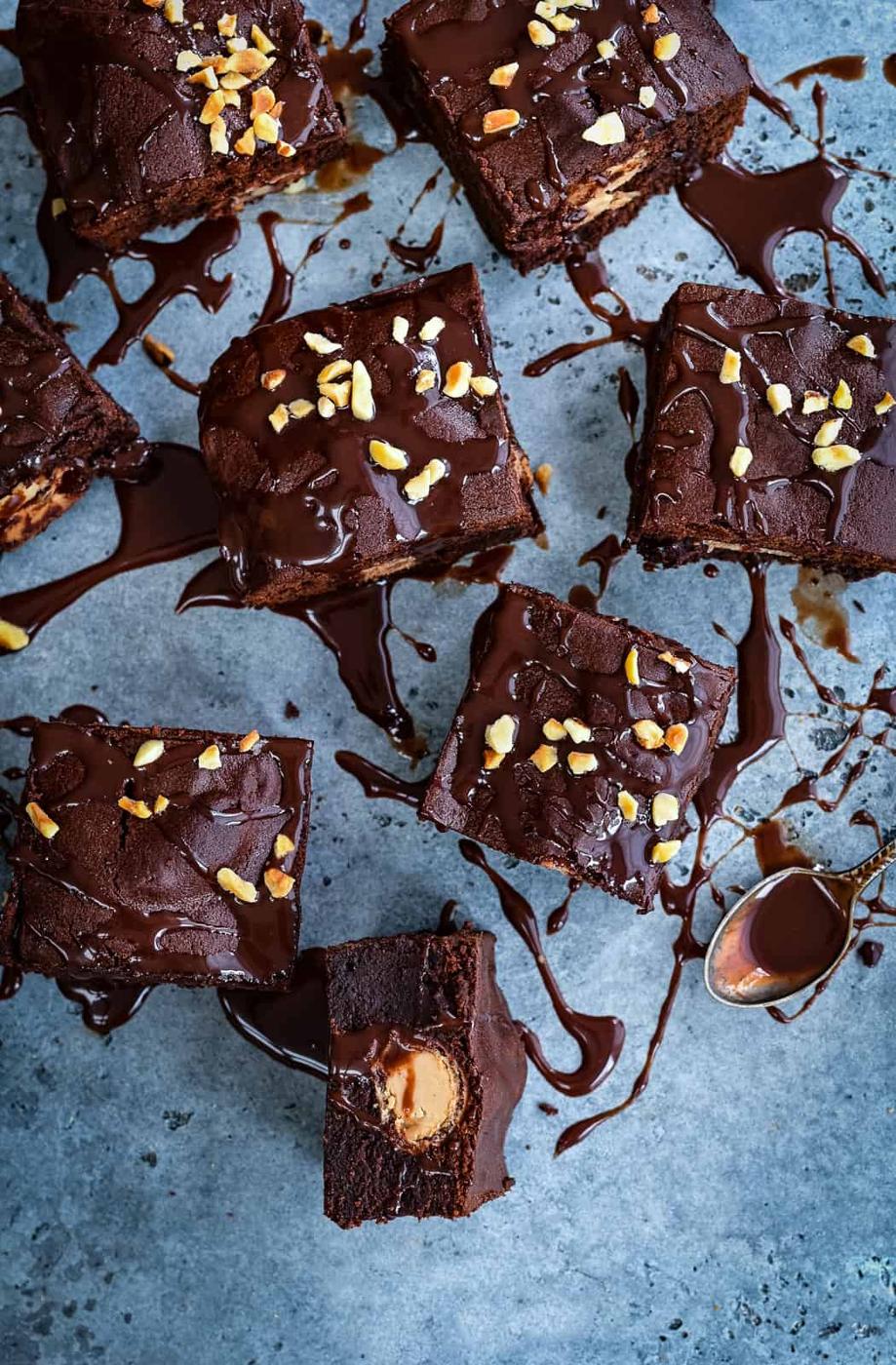 Overhead shot of brownies with Kinder Bueno bars and Nutella drizzle