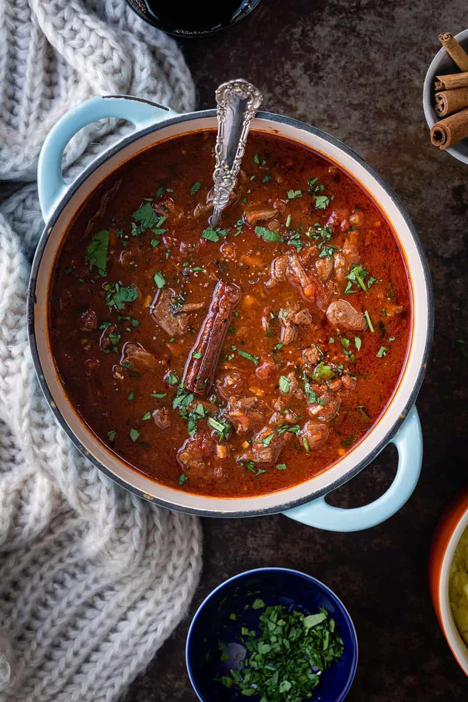 Greek "Kokkinisto" beef stew in a cast iron pot
