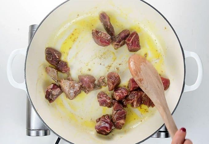 Browning beef in a shallow casserole dish
