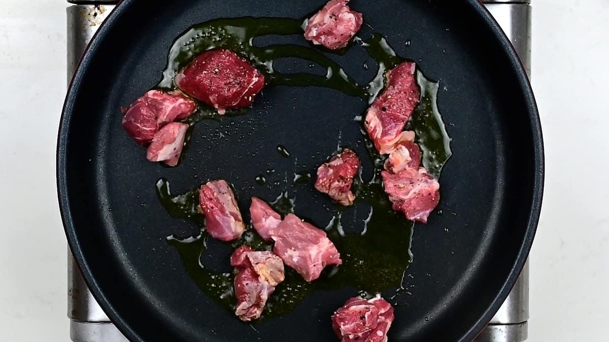 browning lamb in a pan