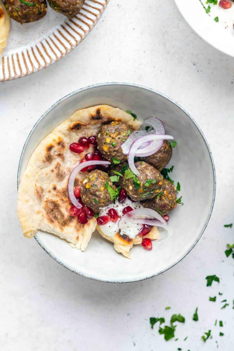 Bowl of meatballs and pita bread