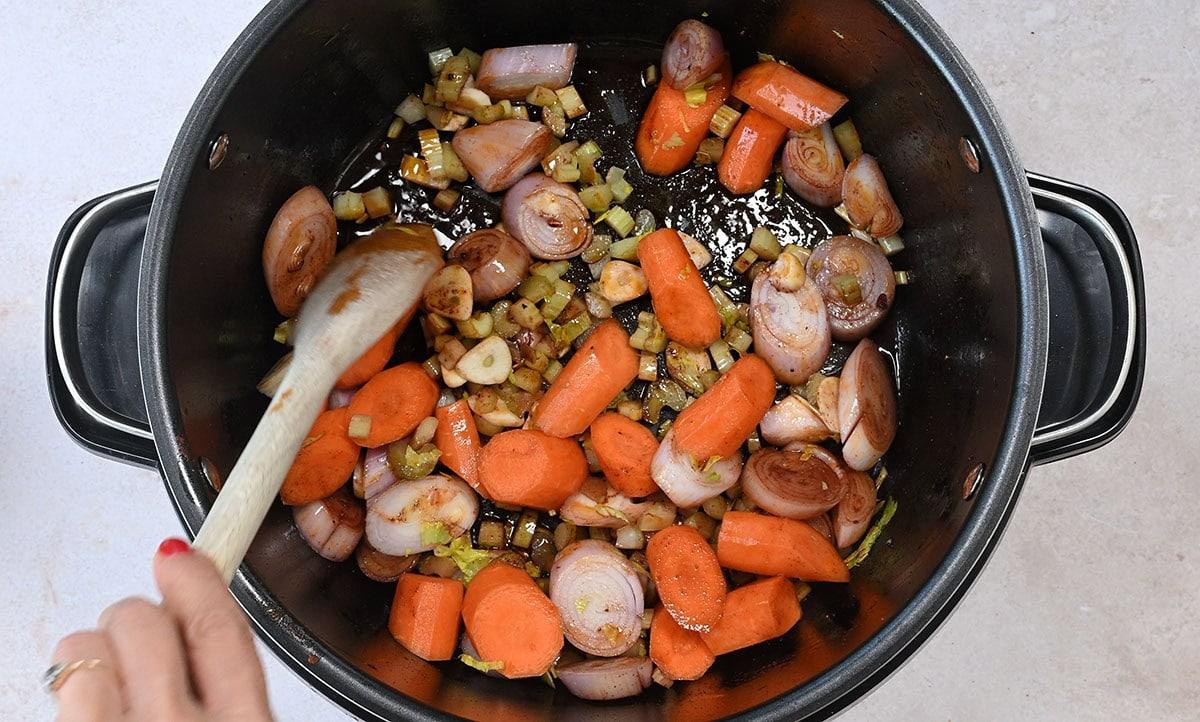 cooking shallots, celery, garlic and carrots in a slow cooker
