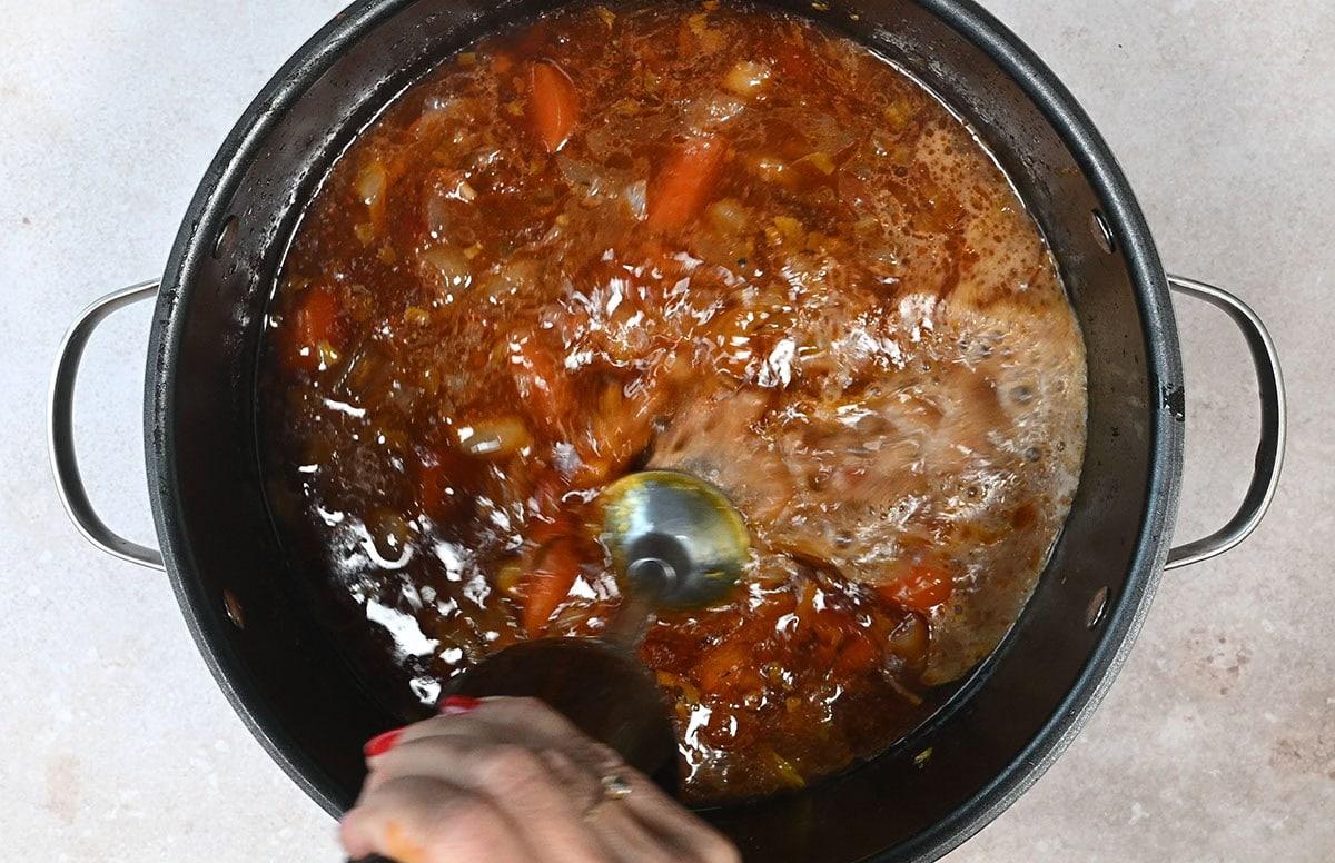 blending sauce with immersion blender