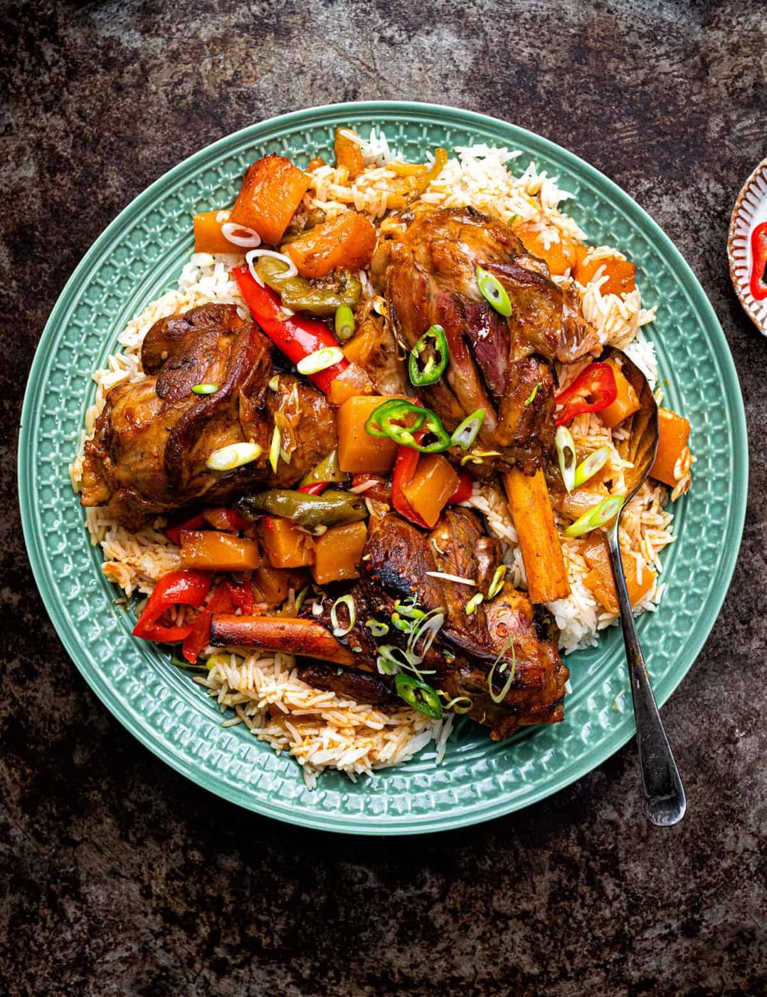 Braised lamb shanks over a bed of coconut rice