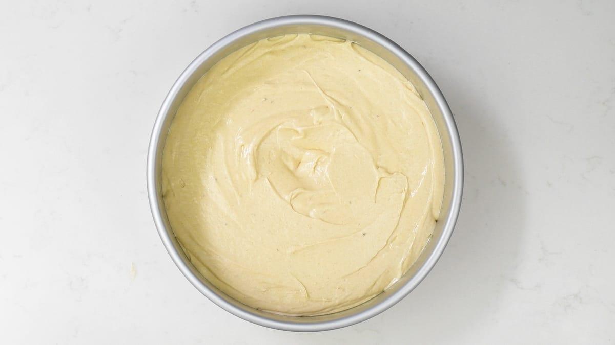 sponge cake batter in a round cake pan