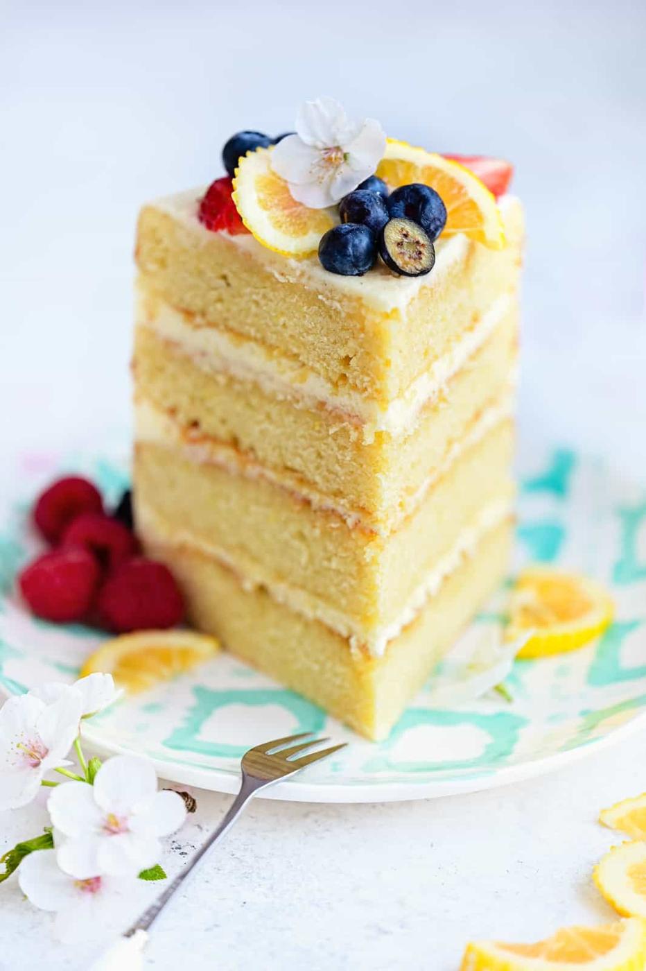 Slice of lemon sponge cake on a patterned plate