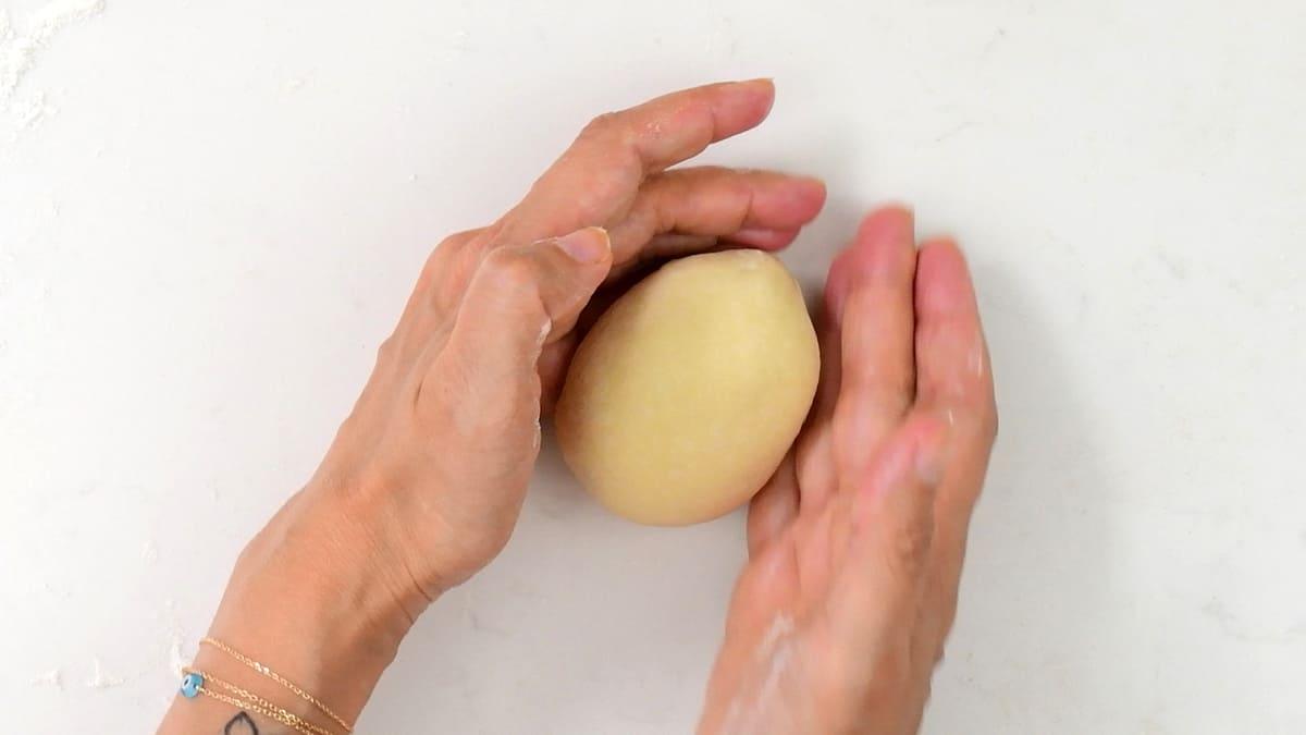 Forming a perfectly round burger bun using palms