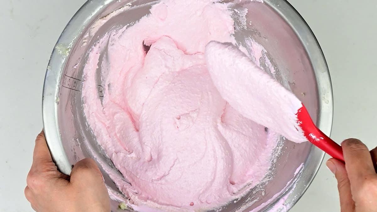 Mixing macaron batter using a silicone spatula