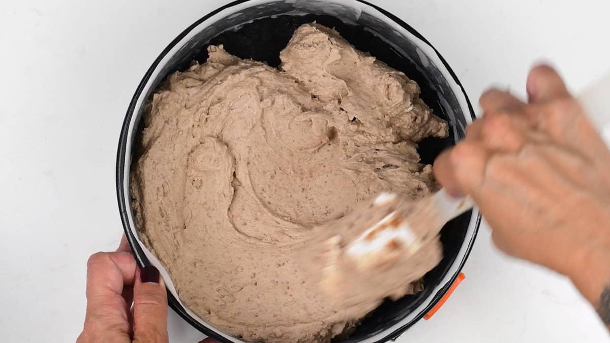 Adding cheesecake filling to springform cake tin