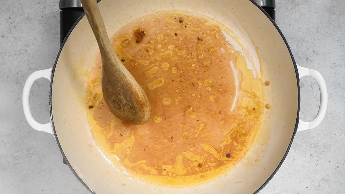 deglazing a casserole dish with wine