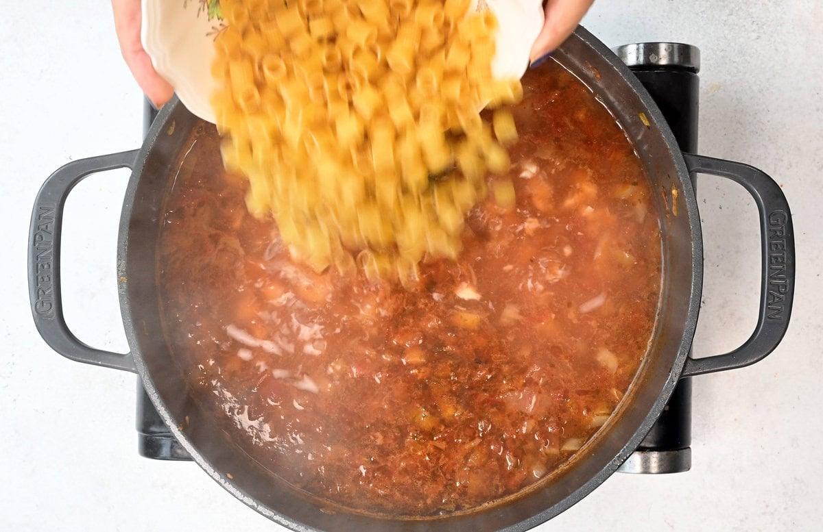 adding pasta to soup
