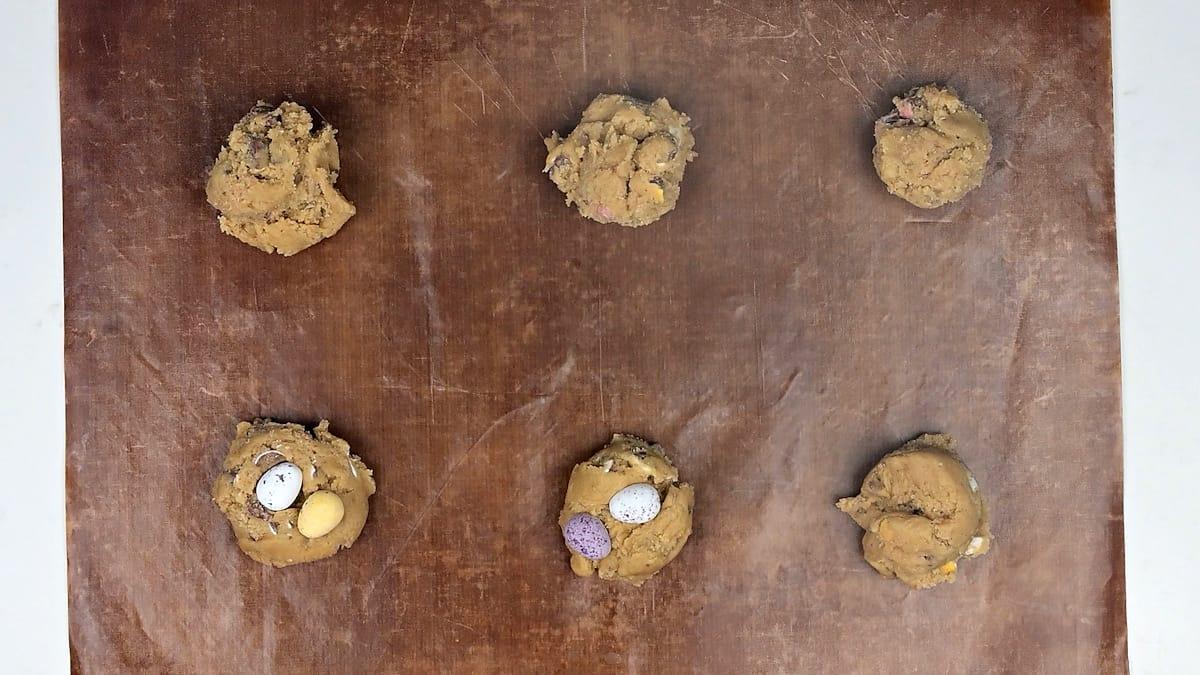 Mini egg cookies on a baking liner