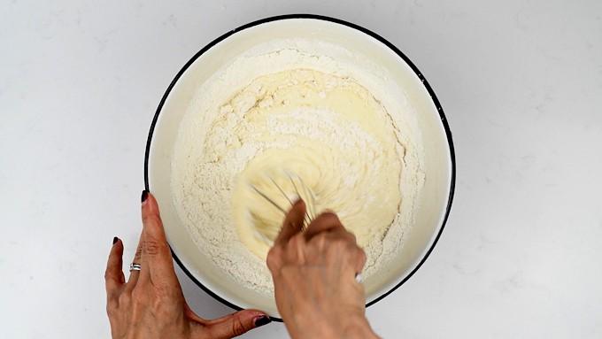 Mixing batter for pancakes in a bowl