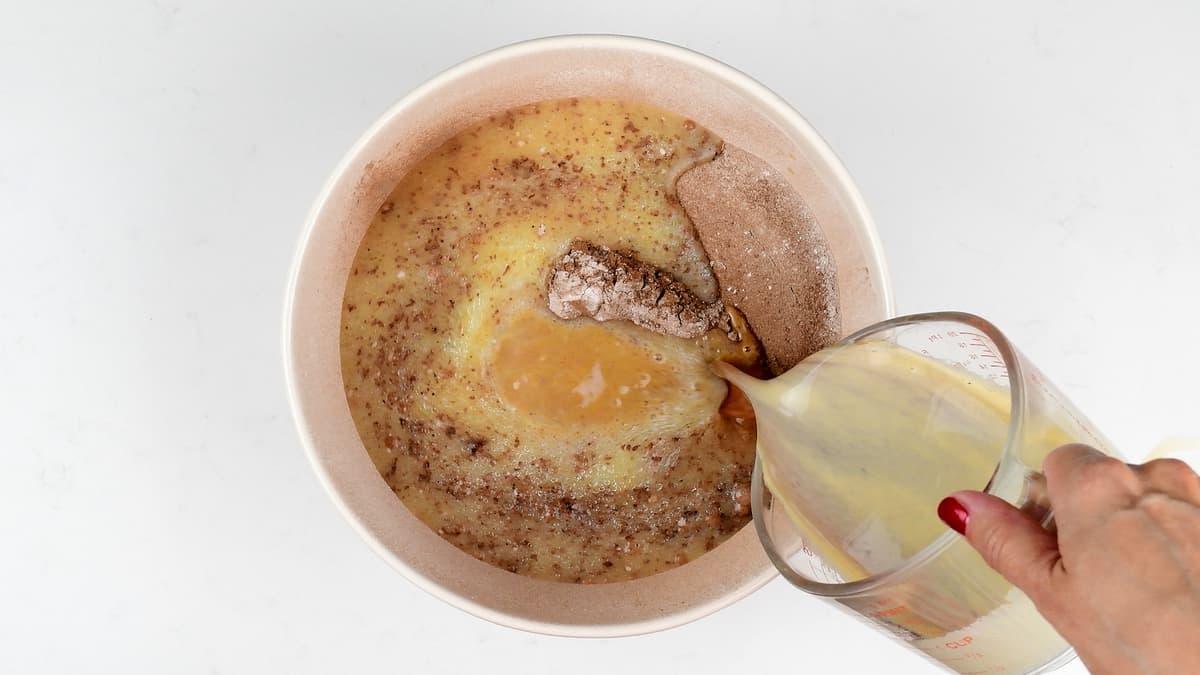 preparing chocolate cake batter in a bowl