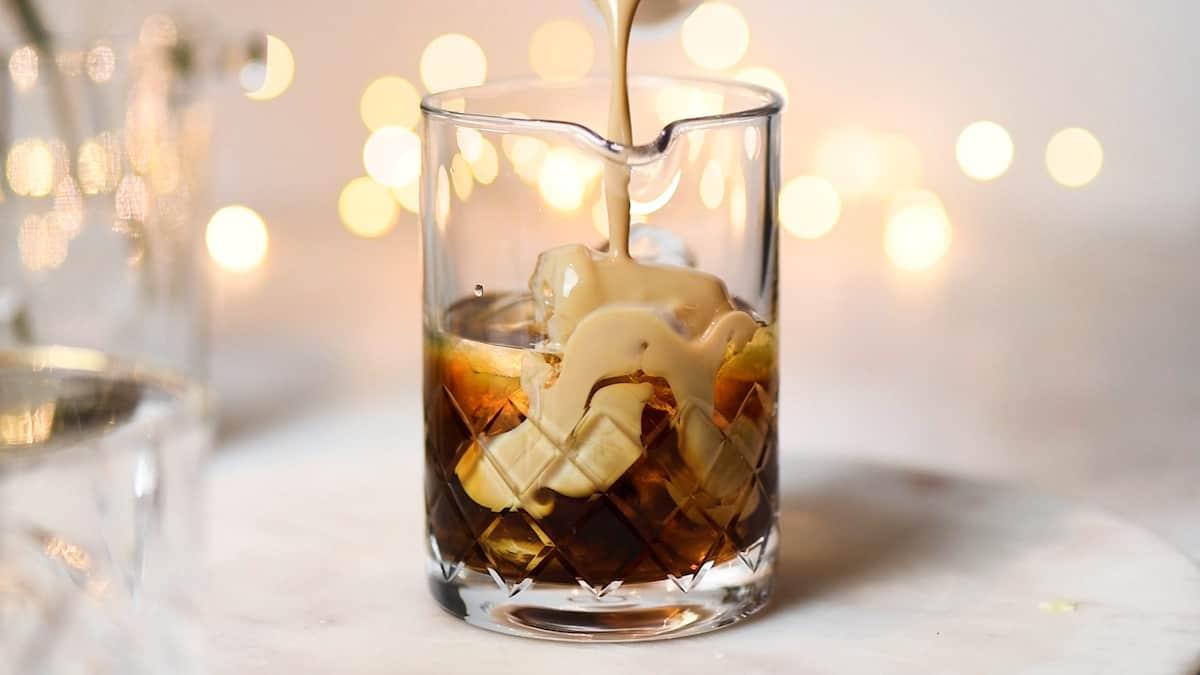 Adding Baileys to mixing jug for Mudslide drink