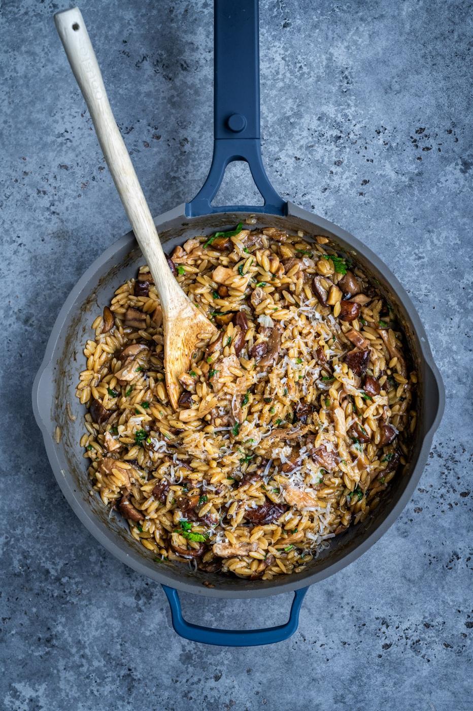 overheat photo of a pan with mushroom orzo (mushroom orzotto)