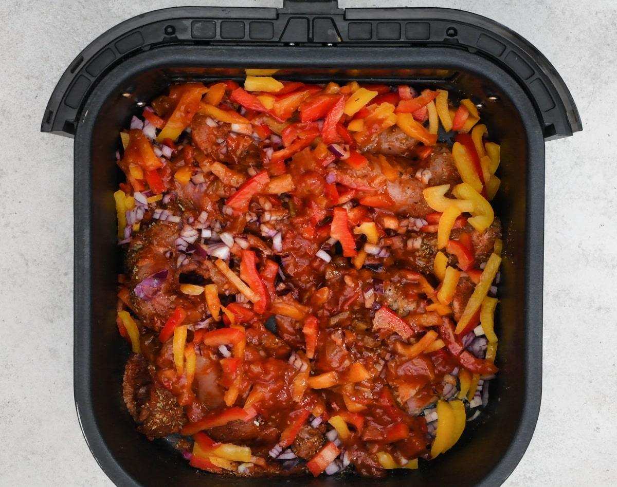 chicken taco meat cooking in an air fryer