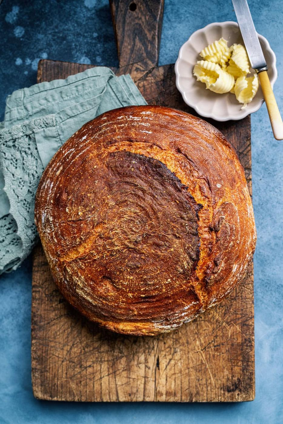 Pumpkin bread loaf on a rustic wooden board
