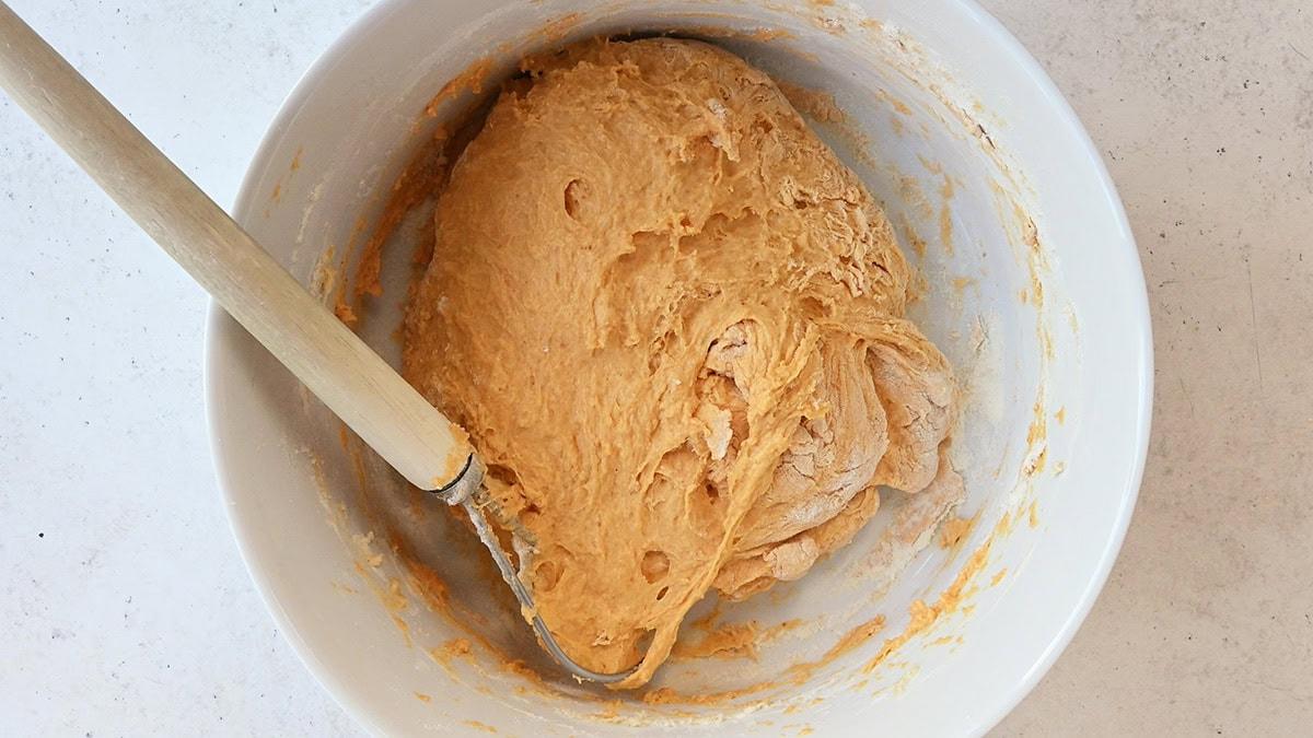 pumpkin bread dough in a mixing bowl