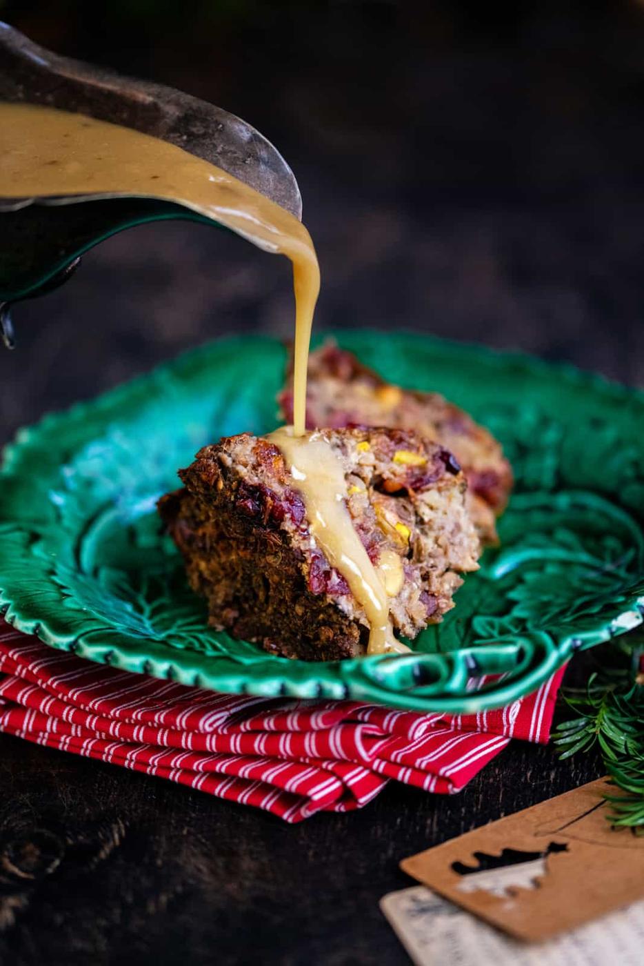 slice of vegan nut roast served with vegan gravy