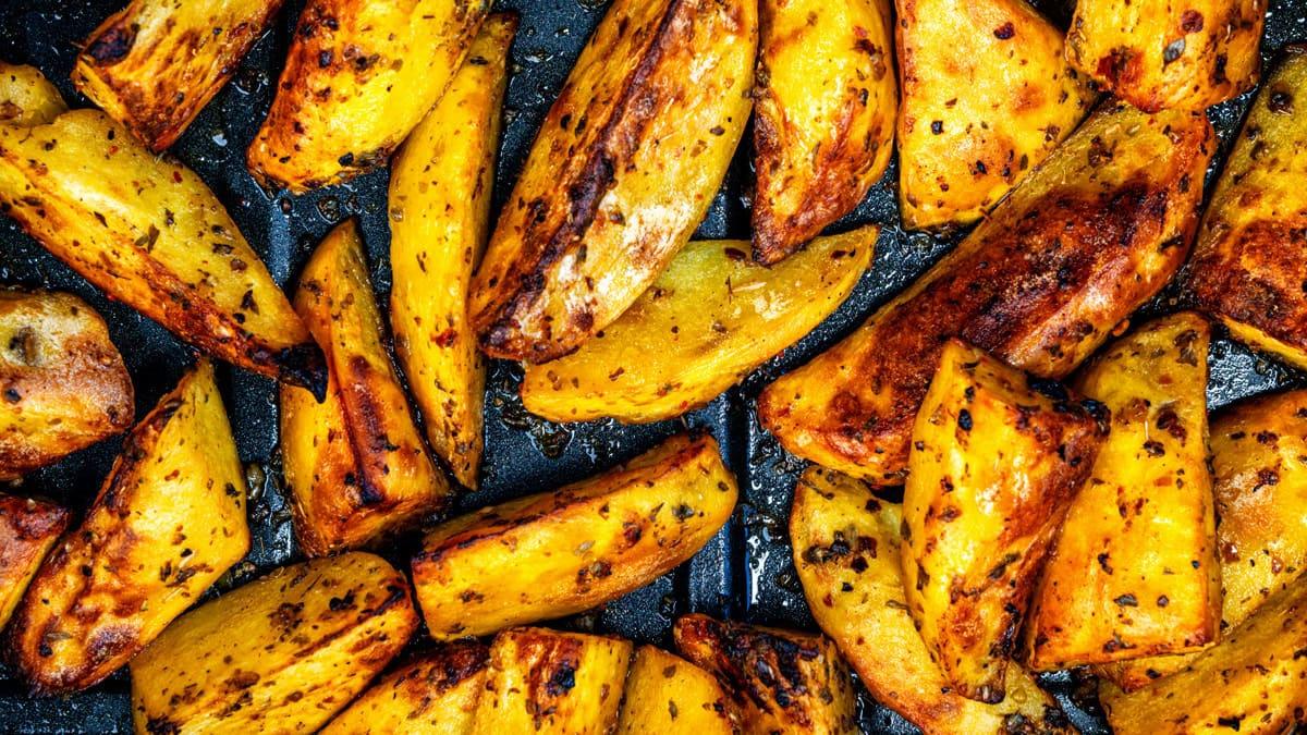 close up on Greek lemon potatoes made extra crispy under the broiler