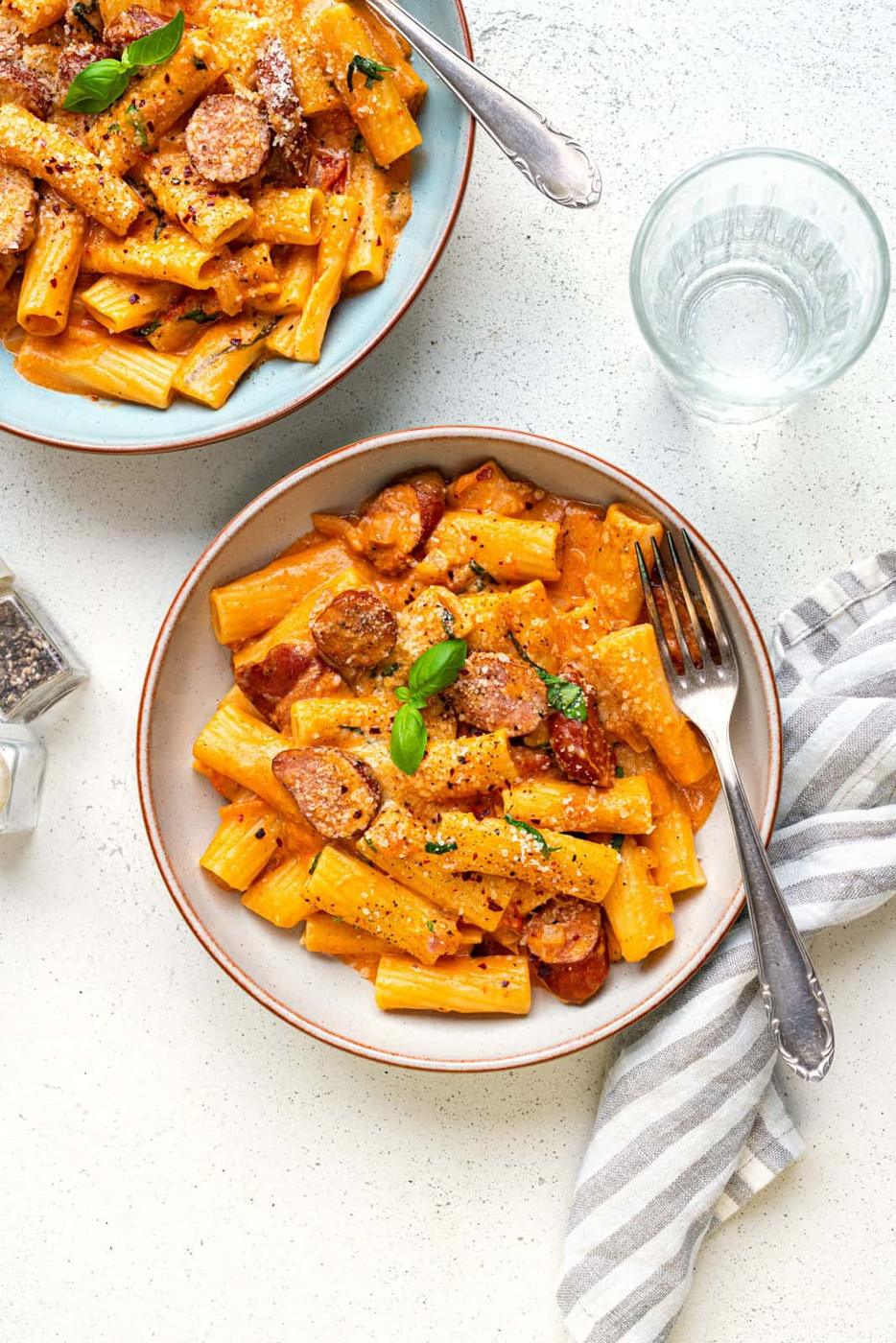 Bowl of sausage pasta in a creamy tomato mascarpone sauce