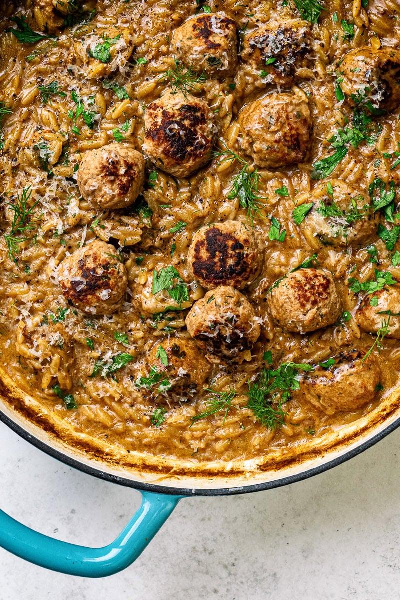Skillet with Swedish meatballs and orzo pasta in a rich creamy gravy