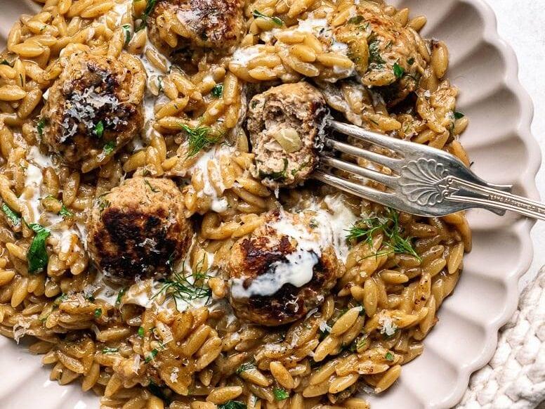 close up on a plate of Swedish meatball orzo dish
