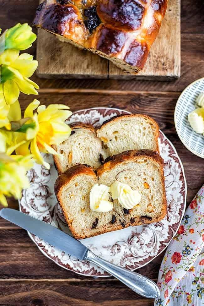 slices of fluffy hot cross bun loaf with butter