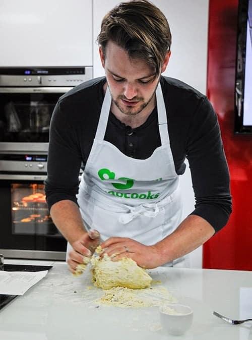 John Wait demonstrating how to make scones