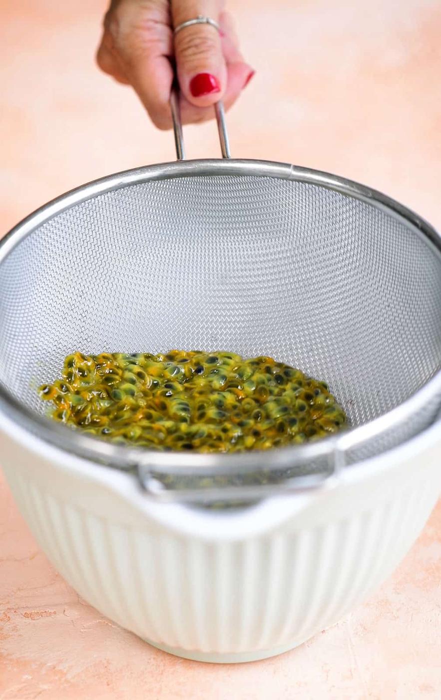straining passion fruit syrup