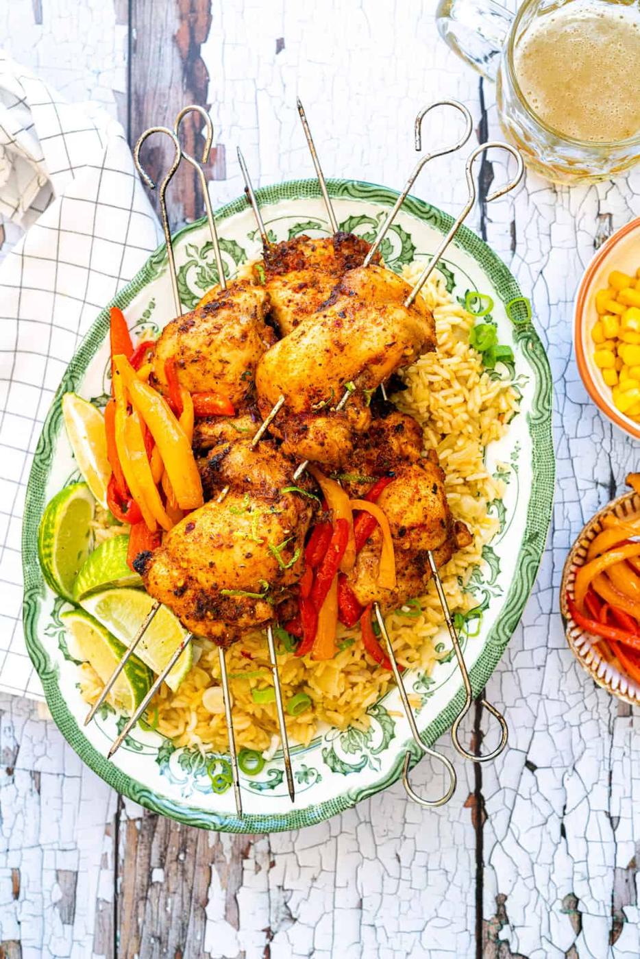 Homemade Nandos Chicken served with peppers and rice on a vintage platter
