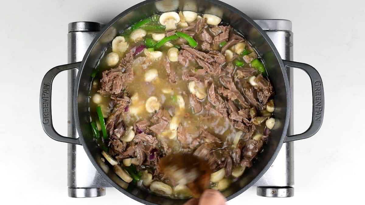 cooking philly cheese steak soup in a Dutch Oven