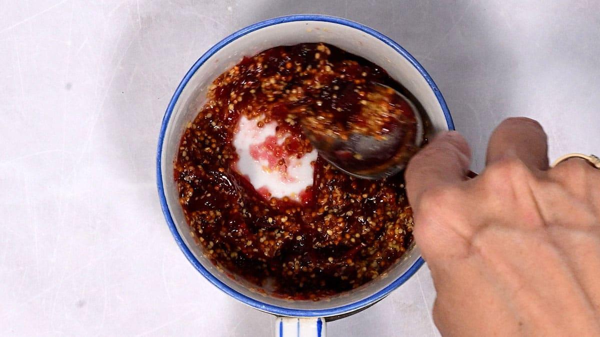 preparing cranberry and mustard dipping sauce