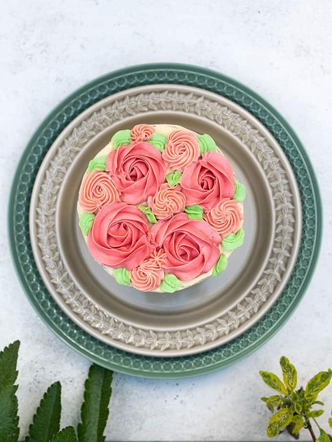 Buttercream decorations on top of a layer cake