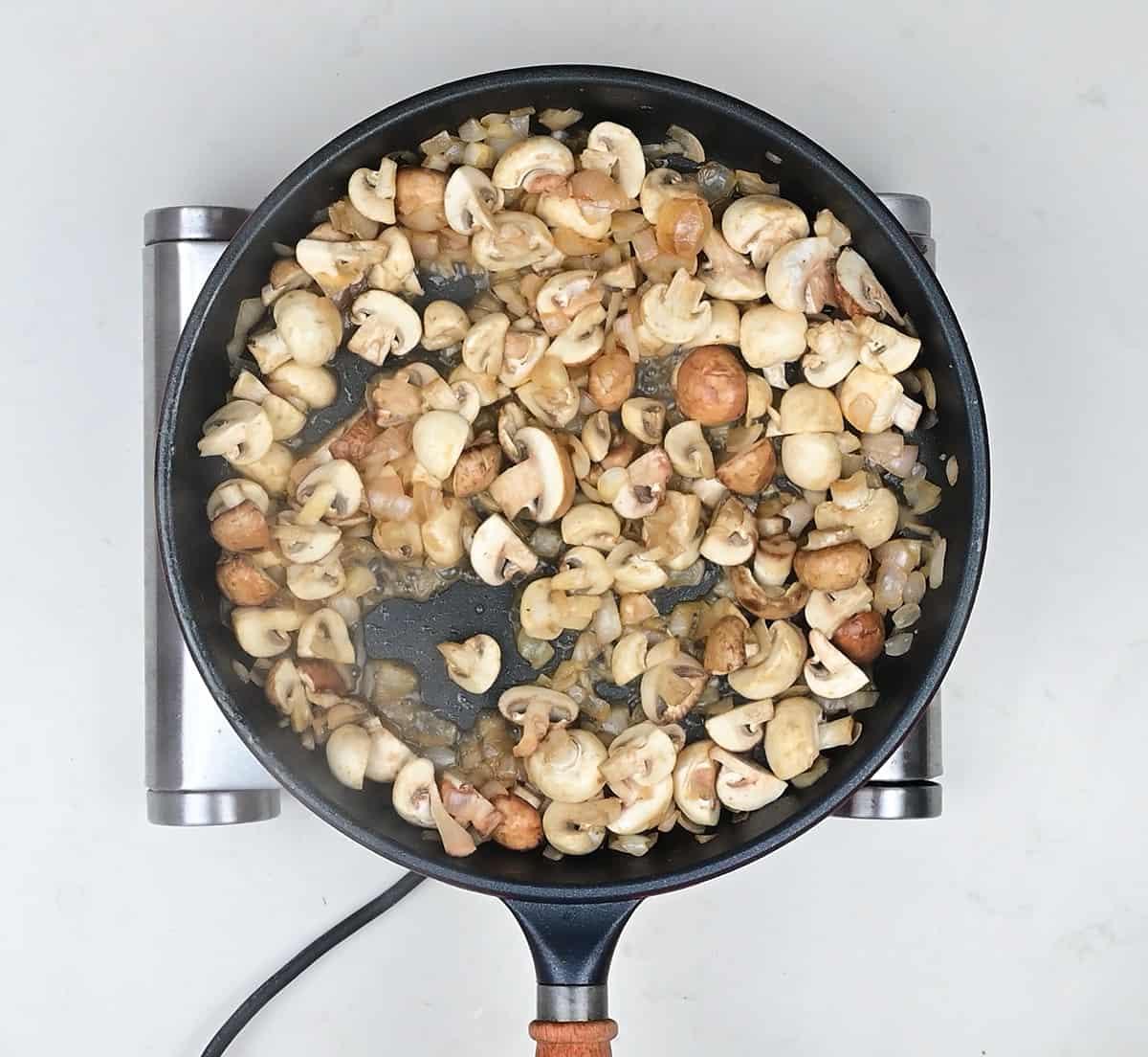 Pan frying mushrroms and shallots