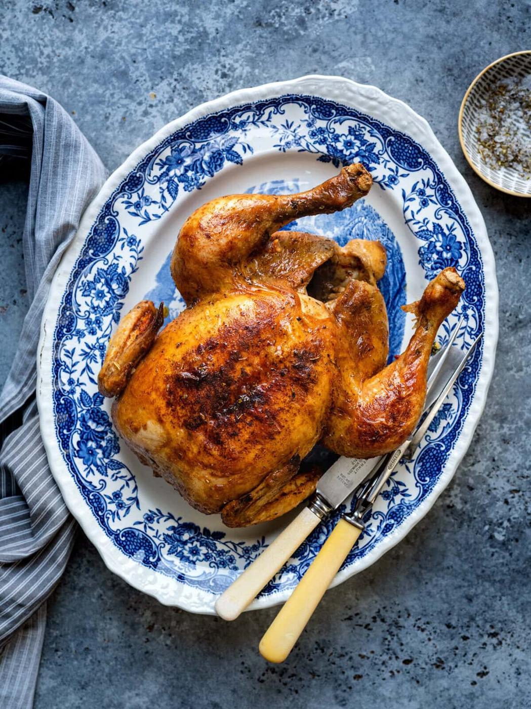 Overhead view of Dutch Oven roast chicken on a platter