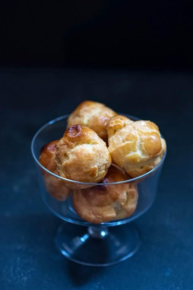 glass bowl full of cream puffs