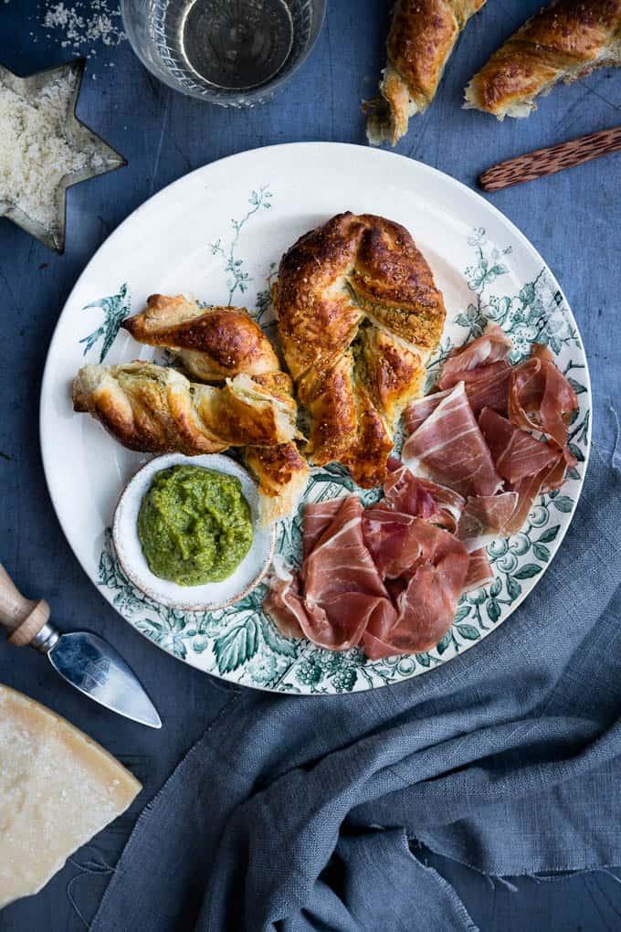 Puff pastry is used to great effect in this quick and easy tart filled with walnut pesto and served with prosciutto